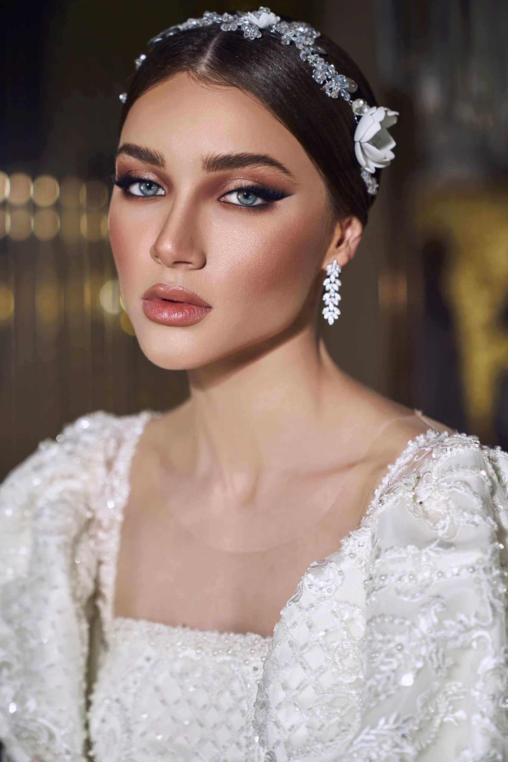 Delicate bridal glam featuring shimmering eyeshadow and a soft blush
