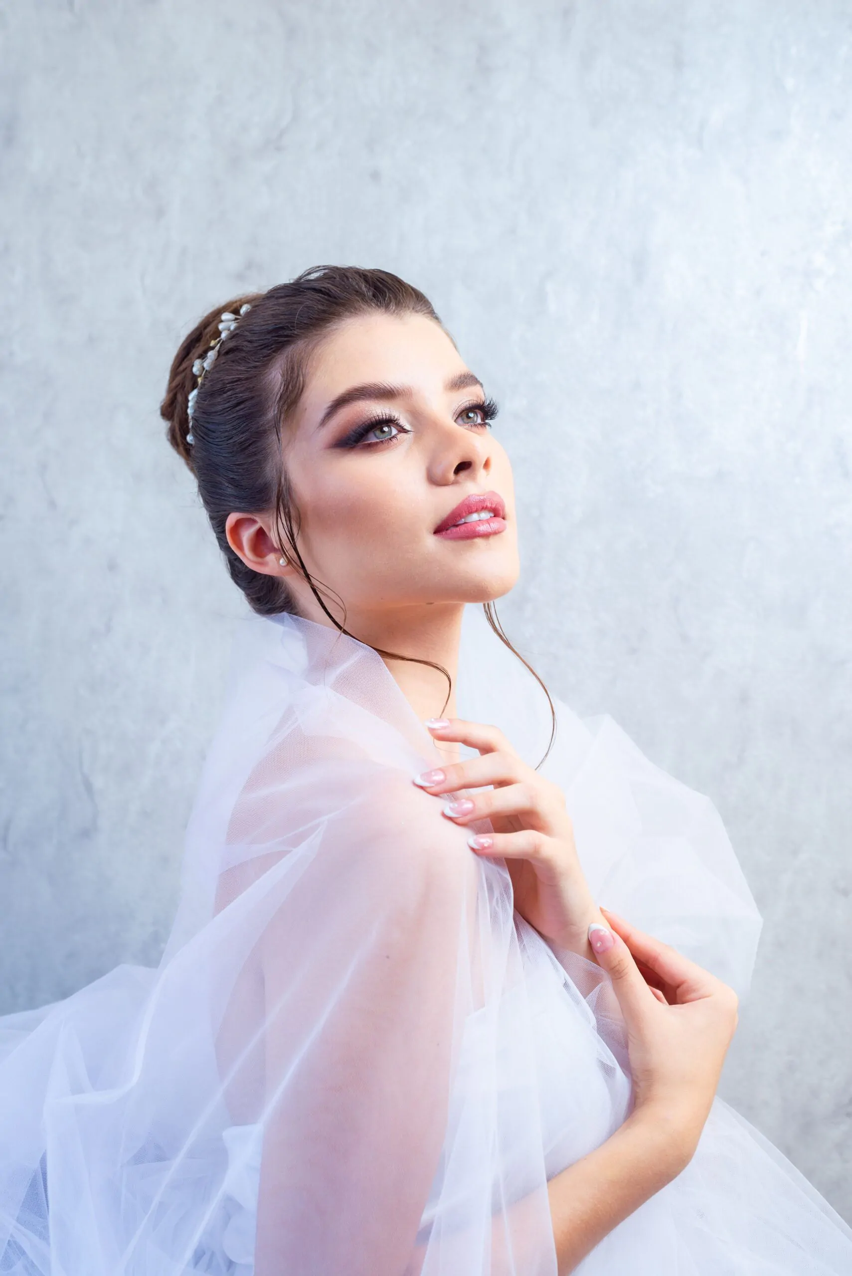 Elegant bridal makeup with a soft contour and satin finish